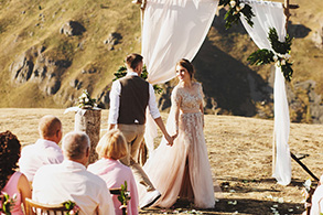 Bride and groom look lovely during the wedding ceremony on the t